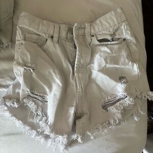 White triple button shorts